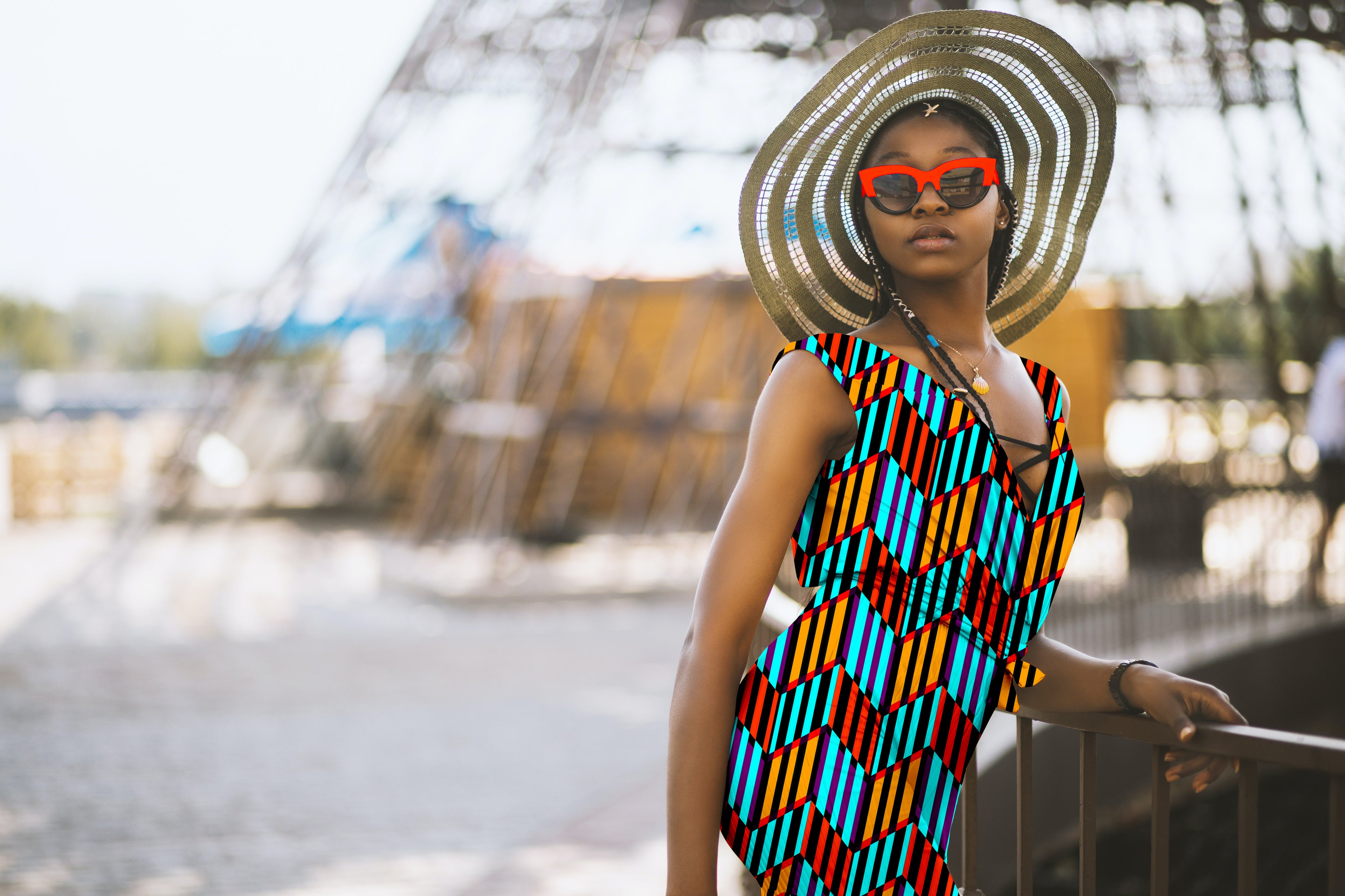 Woman wearing a colorful patterned dress and straw hat with sunglasses, standing outdoors.

Vibrant Aqua Blue and Orange Chevron seamless pattern. High-resolution geometric print for textile and apparel design.