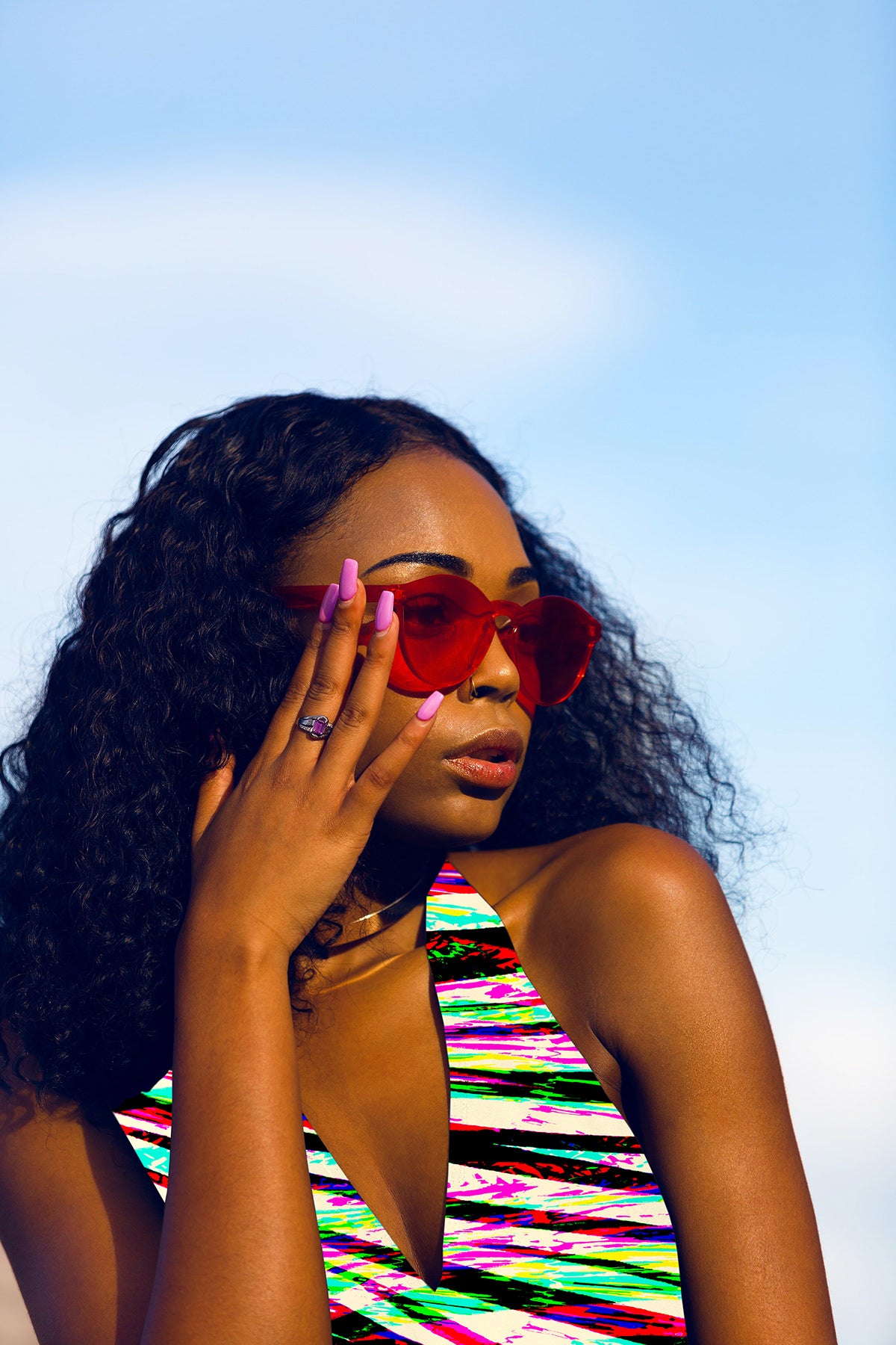 Woman wearing colorful sunglasses and a multicolored dress against a clear blue sky.

Vibrant Multicoloured Zebra Striped seamless pattern. High-resolution abstract animal print with bright colours for textile and apparel design.