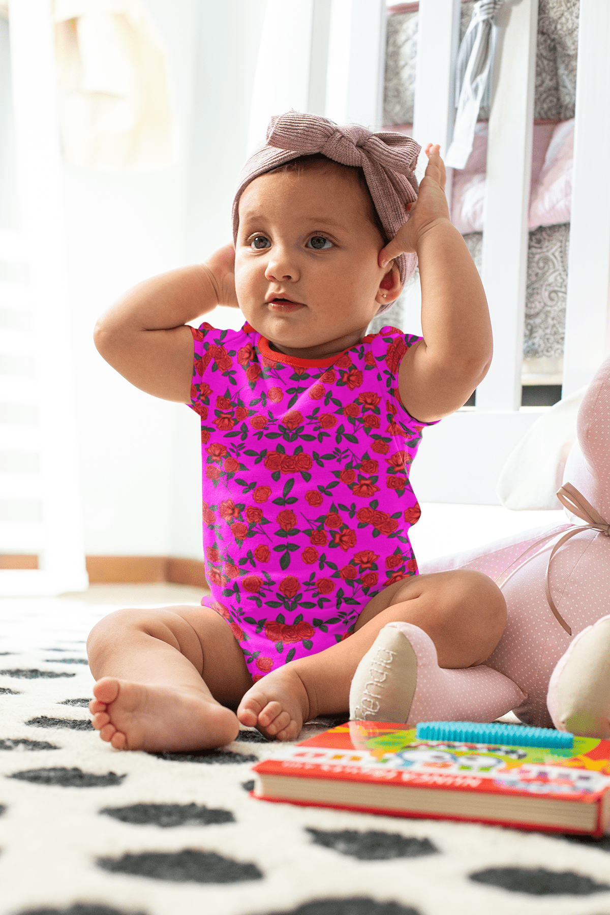 Baby in a pink floral outfit sitting on a patterned rug with a book nearby.

Vibrant Hot Pink Floral seamless pattern with red roses. High-resolution digital flower print for apparel and fabric design.