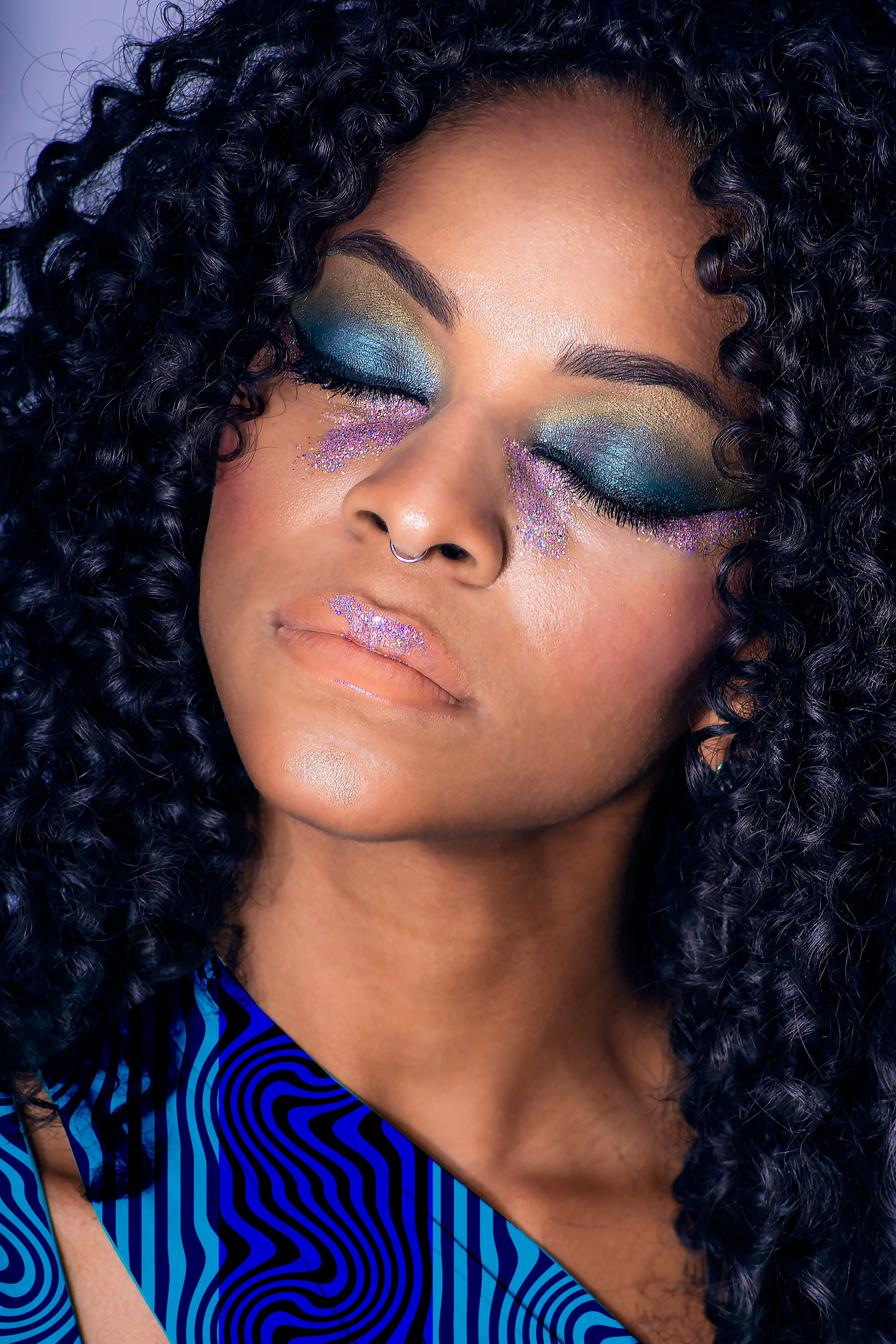 Woman with colorful makeup and a blue and black patterned top

Blue Wavy Textured Stripe seamless pattern (10 Colour Ways). High-resolution fluid geometric print for fabric and apparel design.